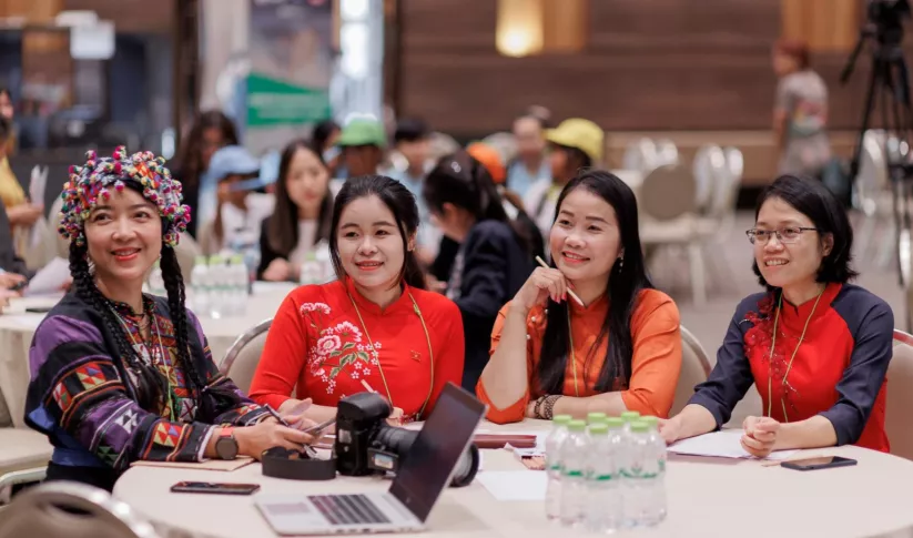 For female participants sit at a table and listen in at SERVIR Southeast Asia’s Inclusive Climate Action Workshop in Chiang Mai, Thailand, held Feb 12-16. Credit: ADPC