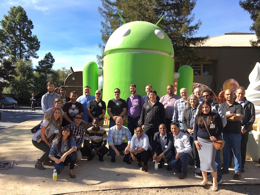 Exchange attendees group photo with Android statue