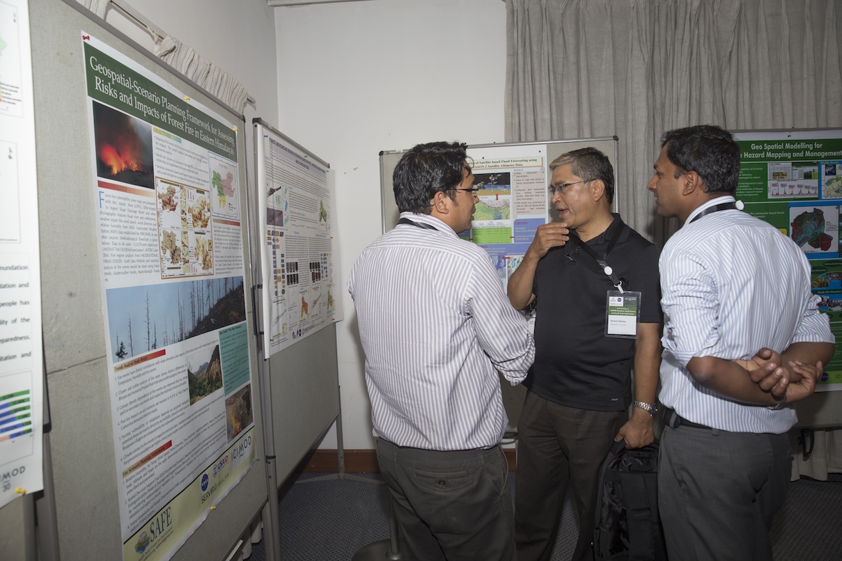 Participants view grantee posters